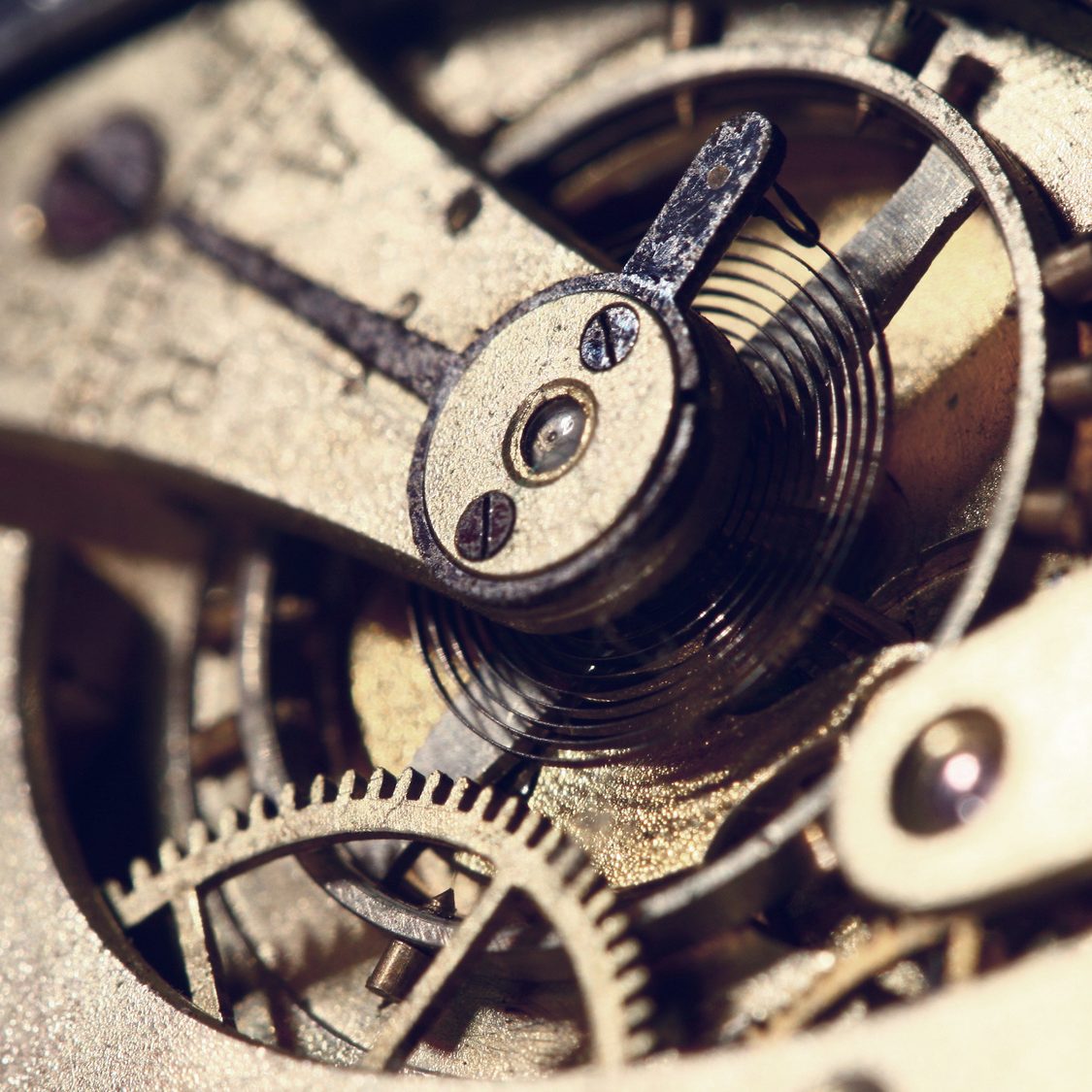 Old clock mechanism with cogwheels macro